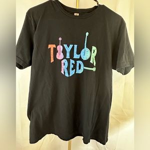 Taylor Red t-shirt. Short sleeve. Size Medium. Black tee with multicolored print
